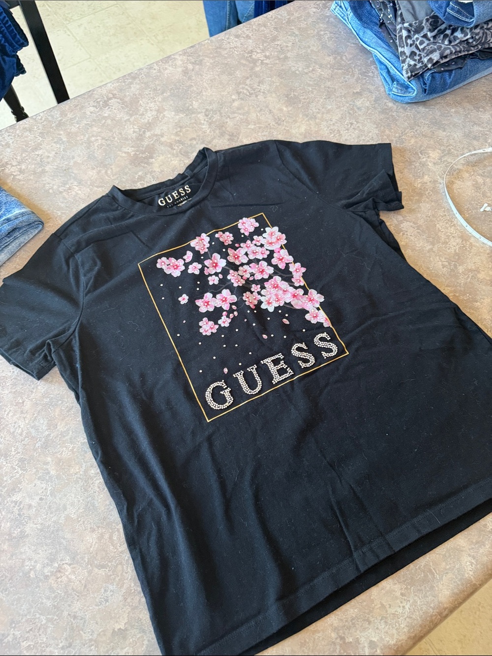 Guess Black Tee with Pink Floral Cluster and Gold Border